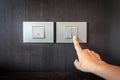 Hand pressing electronic-light switch Royalty Free Stock Photo