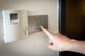 Hand pressing electronic-light switch Royalty Free Stock Photo