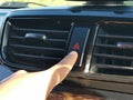 Hand pressing emergency button in the dashboard car. Royalty Free Stock Photo