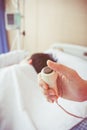 Hand pressing emergency nurse call button. Royalty Free Stock Photo