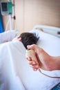 Hand pressing emergency nurse call button. Royalty Free Stock Photo