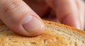Hand pressing finger on bread slice Royalty Free Stock Photo