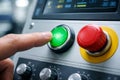 Hand Pressing Green Start Button on Industrial Machine Control Panel Royalty Free Stock Photo