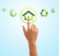 Hand pressing home symbol from eco green icons Royalty Free Stock Photo