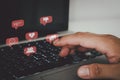 Hand pressing the keyboard of a laptop computer. Icon virtual interface technology concept. Social networks bully Gossips, Royalty Free Stock Photo