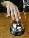 Hand Pressing an old Service Bell Royalty Free Stock Photo