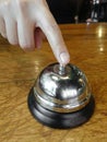 Hand Pressing an old Service Bell Royalty Free Stock Photo