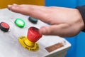 Hand pressing the red emergency button or stop button for industrial machine, Emergency Stop for Safety. Royalty Free Stock Photo