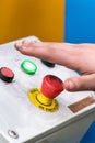 Hand pressing the red emergency button or stop button for industrial machine, Emergency Stop for Safety. Royalty Free Stock Photo