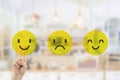 Hand pressing smile emotion icons for giving best service ranking. Royalty Free Stock Photo
