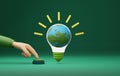 Hand pressing start button light bulb on green background Royalty Free Stock Photo