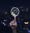 Hand pressing telephone and mail icon button over blurred light Royalty Free Stock Photo