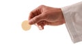 Hand of a priest with consecrated host and white background