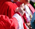 priest with large ring during the blessing of the faithful at the end of the religious event during the holidays Royalty Free Stock Photo