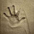 Hand print on cement mortar wall
