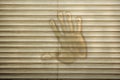 Hand print on closed blinds Royalty Free Stock Photo