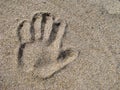 Hand print in sand Royalty Free Stock Photo