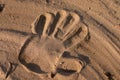 Hand print in sand Royalty Free Stock Photo