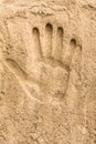 Hand print on the sand beach texture background Royalty Free Stock Photo