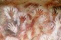 Hand prints on a cave wall cueva de las manos Royalty Free Stock Photo