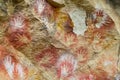 Hand prints on stone cave wall