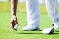 Hand of Professional Golf Player teach how to Teed Up Golf Ball