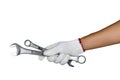 A hand with protection glove holding spanners Royalty Free Stock Photo