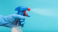 Hand in protective glove spraying disinfectant Royalty Free Stock Photo