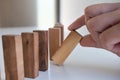 Hand pull block wood game, gambling placing wooden block. Concept Risk of management and strategy plan, protect business Royalty Free Stock Photo