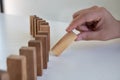 Hand pull block wood game, gambling placing wooden block. Concept Risk of management and strategy plan, protect business Royalty Free Stock Photo