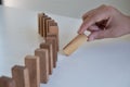 Hand pull block wood game, gambling placing wooden block. Concept Risk of management and strategy plan, protect business Royalty Free Stock Photo