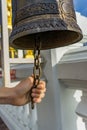 Handle ringing a bell in a Buddhist temple Royalty Free Stock Photo