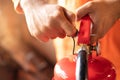 Hand Pull latch presses the trigger fire extinguisher Royalty Free Stock Photo