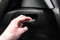 Hand pulling car interior door handle, opening car door. Royalty Free Stock Photo