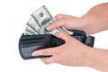 Hand pulling 100 dollars banknotes from wallet Royalty Free Stock Photo