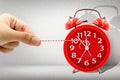 Hand pulling rope for stop time on clock Royalty Free Stock Photo