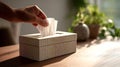 Hand pulling white cleansing tissue from dispenser box Royalty Free Stock Photo