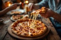 Stunning cheesy pepperoni pizza slice being pulled creating long cheese strings at a cozy gathering Royalty Free Stock Photo