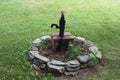 Hand pump and flower bed