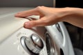 Hand push on auto washing machine. Generate Ai