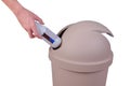 Hand push a trash into Big brown trashcan or waste bin on white Royalty Free Stock Photo