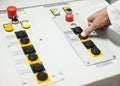 Hand pushing the button on the control panel Royalty Free Stock Photo