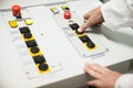 Hand pushing the button on the control panel Royalty Free Stock Photo