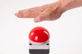 Hand pushing a red buzzer Royalty Free Stock Photo