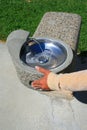 Hand Pushing Water Fountain