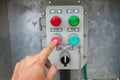 Hand put button switch to control box Royalty Free Stock Photo