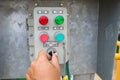 Hand put button switch to control box Royalty Free Stock Photo