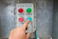 Hand put button switch to control box Royalty Free Stock Photo