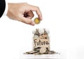 Hand put coin in glass jar, saving money for Future, on white background Royalty Free Stock Photo