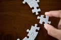 Hand put the last piece of jigsaw puzzle to complete the mission, Business solutions, success and strategy concept Royalty Free Stock Photo